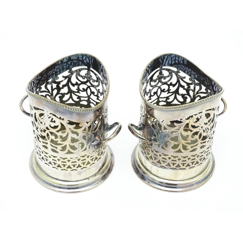 680 - A pair of 19thC silver plate bottle coasters with turned wooden bases. Together with a pair of silve... 