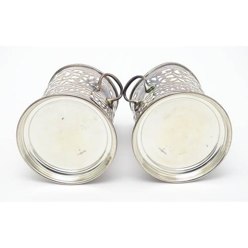 680 - A pair of 19thC silver plate bottle coasters with turned wooden bases. Together with a pair of silve... 