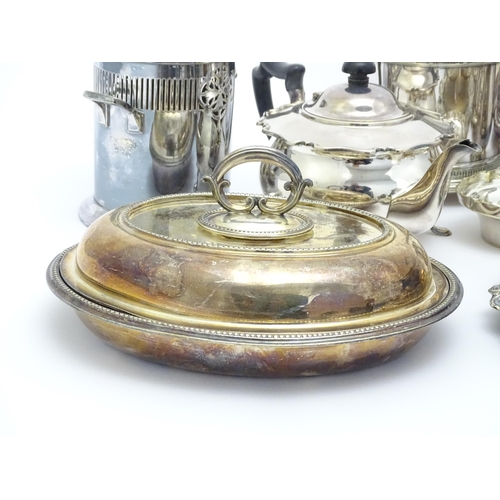 682 - A quantity of assorted silver plated wares to include sauce boats, serving dishes, cruets, teapot, s... 