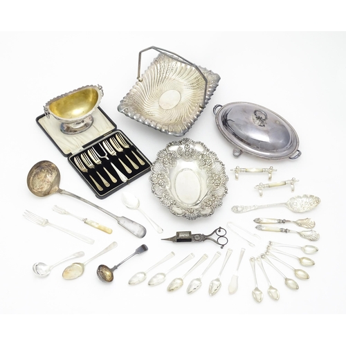 687 - A quantity of assorted silver plated wares to include cake baskets, entree dishes, cake forks, berry... 