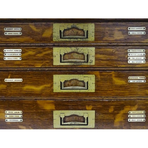 689 - An oak cased cutlery chest / canteen, the twin doors opening to reveal four fitted drawers within, c... 