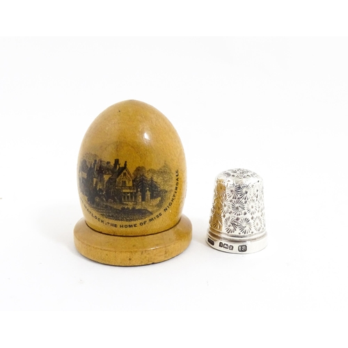 1151 - A 19thC Mauchline ware sewing thimble case of dome form with a vignette depicting Lea Hurst, Near Ma... 