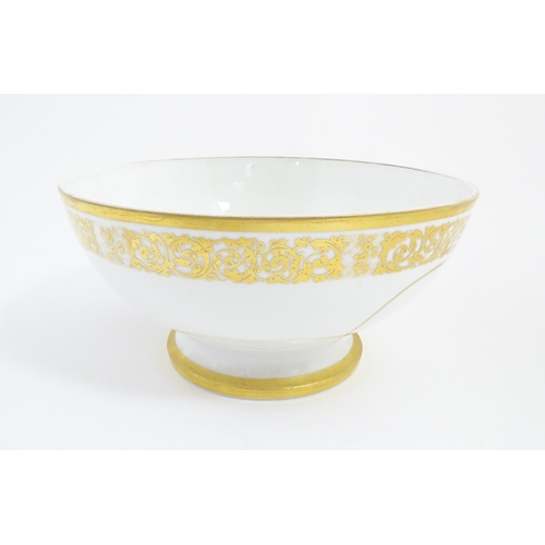 115A - An English pedestal bowl with hand painted sailing ship vignette and gilt scrolling foliate border. ... 