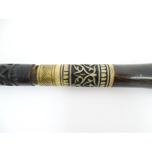 1249 - An early 20thC Indian sword stick with horn handle with brass lion mask pommel, the ebonised shaft w... 