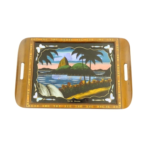 1270 - A 20thC Brazilian twin handled tray set with central scene depicting a Rio de Janeiro view with butt... 