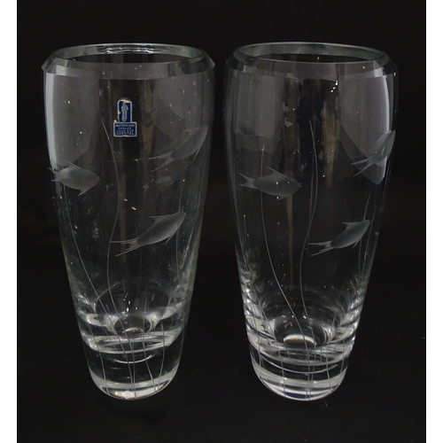 204 - A pair of Whitefriars glass vases each with engraved fish and reed decoration designed by Geoffrey B... 