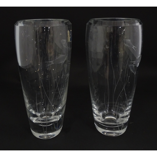 204 - A pair of Whitefriars glass vases each with engraved fish and reed decoration designed by Geoffrey B... 