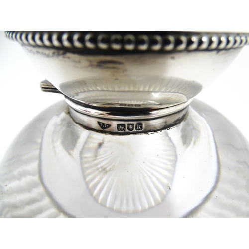 209 - A glass inkwell with silver top hallmarked London 1905 maker James Dudley and stamped J Dudley South... 