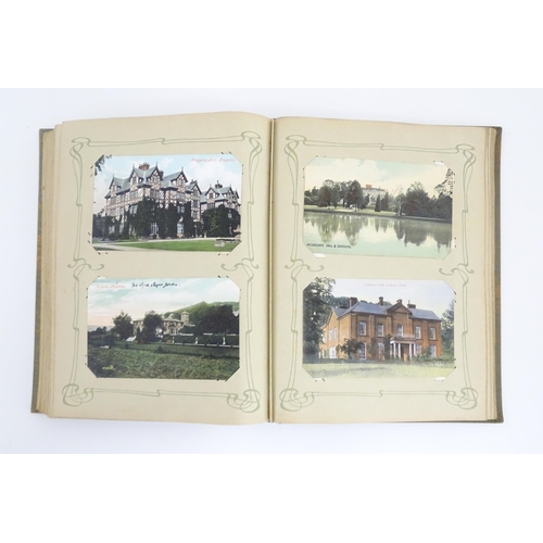 2139 - A 20thC postcard album to include various Royal residences, country houses and palaces to include Wi... 