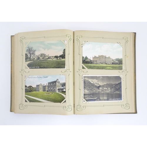 2139 - A 20thC postcard album to include various Royal residences, country houses and palaces to include Wi... 