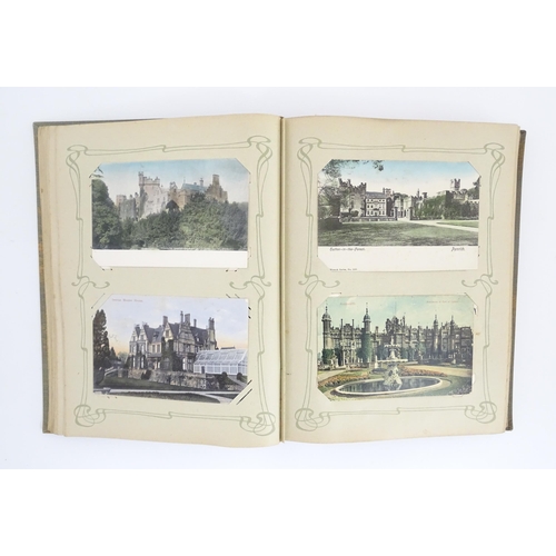 2139 - A 20thC postcard album to include various Royal residences, country houses and palaces to include Wi... 