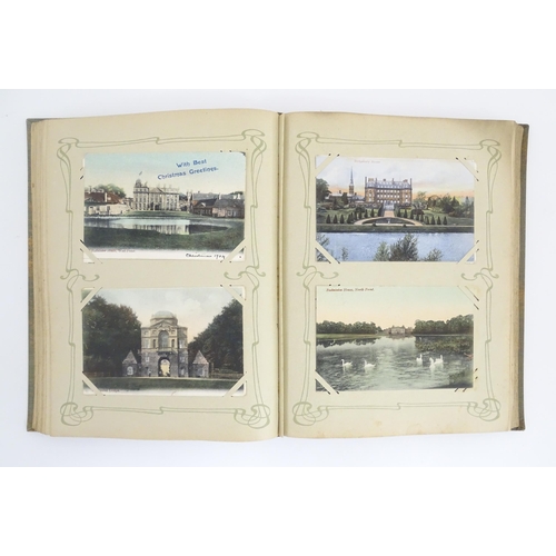 2139 - A 20thC postcard album to include various Royal residences, country houses and palaces to include Wi... 