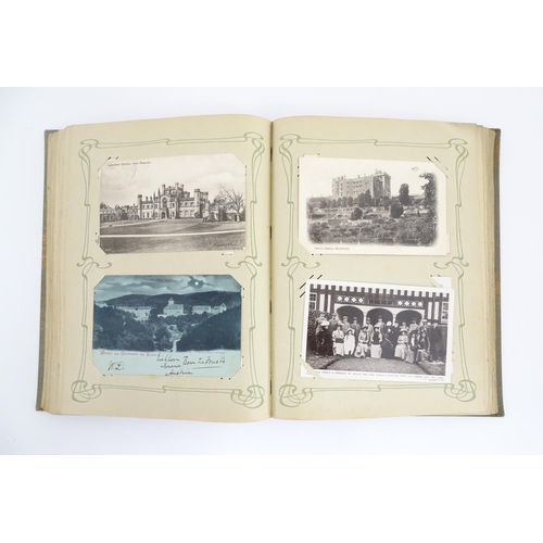 2139 - A 20thC postcard album to include various Royal residences, country houses and palaces to include Wi... 