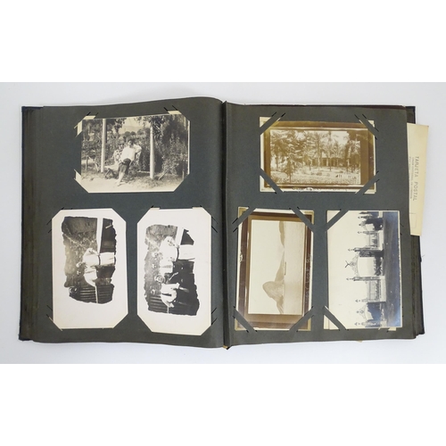 2141 - An early 20thC photograph and postcard album containing various South American scenes to include Esp... 