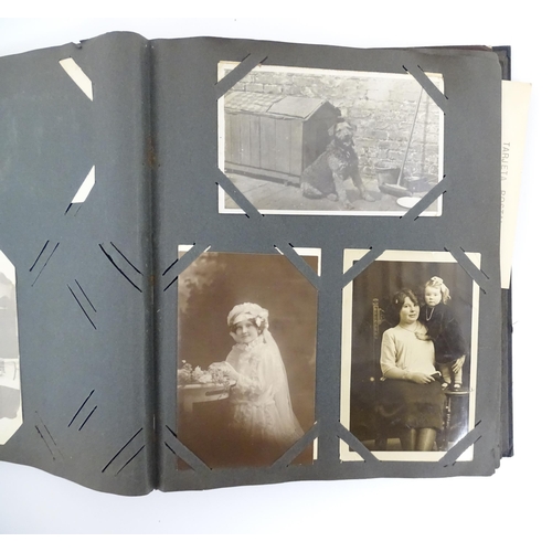 2141 - An early 20thC photograph and postcard album containing various South American scenes to include Esp... 