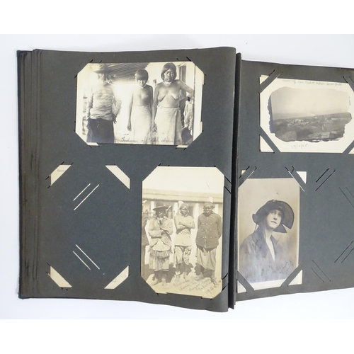 2141 - An early 20thC photograph and postcard album containing various South American scenes to include Esp... 