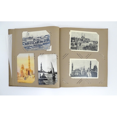 2143 - A 20thC postcard / greetings card album to include humorous examples, topographical views, church in... 