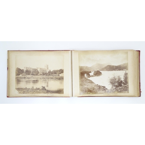 2146 - A Victorian photograph album containing various views to include Lincoln Cathedral, Dairy Bridge Rok... 