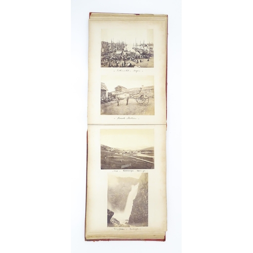 2146 - A Victorian photograph album containing various views to include Lincoln Cathedral, Dairy Bridge Rok... 