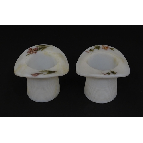 216 - A pair of milk glass match holders / vesta keeps  formed as top hats with hand painted floral detail... 