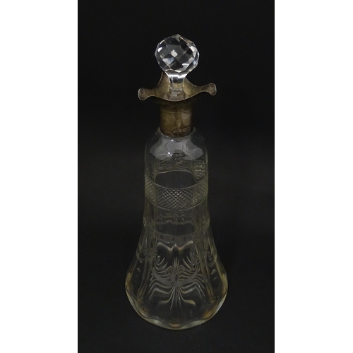 265 - A cut glass decanter with silver mounts hallmarked Birmingham 1911. Approx. 9 1/4