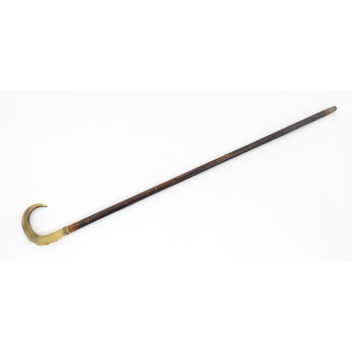 1246 - A late 19th / early 20thC Spanish Toledo sword stick with horn handle, silver plate mount and push b... 