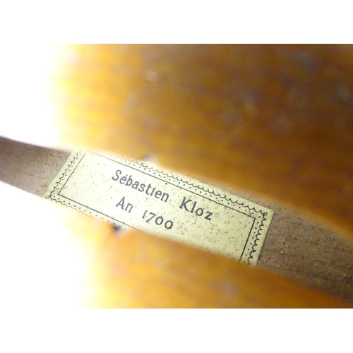 1291 - Musical Instrument : a 20thC violin , bearing interior label ' Sebastien Kloz - An 1700 ', together ... 