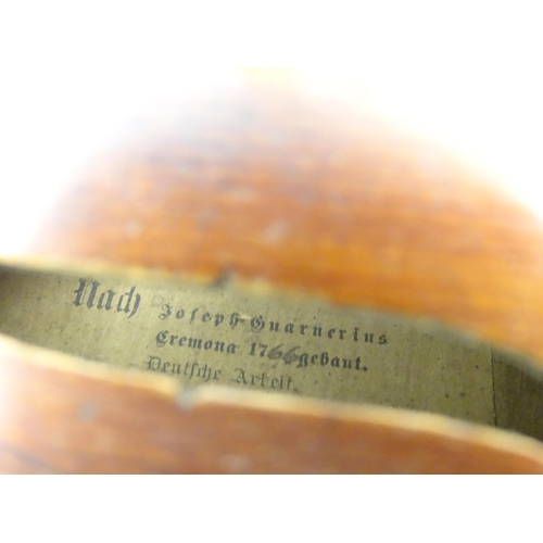 1292 - Musical Instruments : a late 19thC German violin, bearing interior label 'Nach (Joseph Guarnerius Cr... 