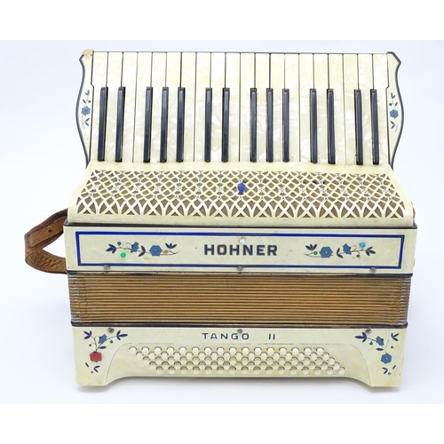 1293 - Musical Instrument : a c1930s Hohner Tango II accordion, the body decorated with floral inlay, 34 ke... 