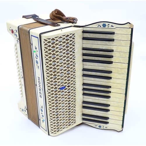 1293 - Musical Instrument : a c1930s Hohner Tango II accordion, the body decorated with floral inlay, 34 ke... 