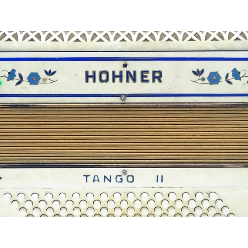 1293 - Musical Instrument : a c1930s Hohner Tango II accordion, the body decorated with floral inlay, 34 ke... 