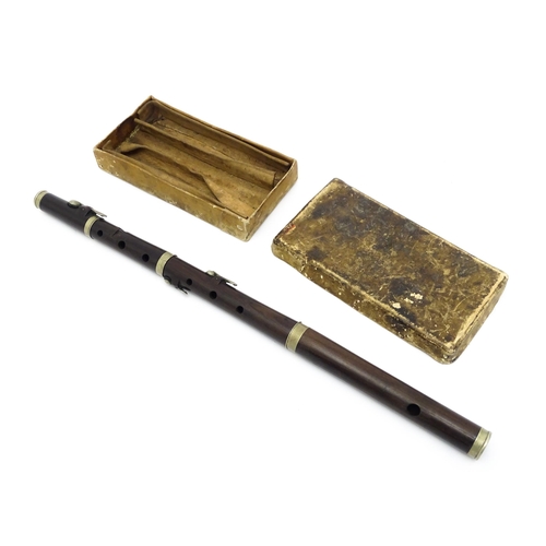 1294 - Musical Instrument : the major parts of an early 20thC three-piece piccolo flute, approx 19 1/2