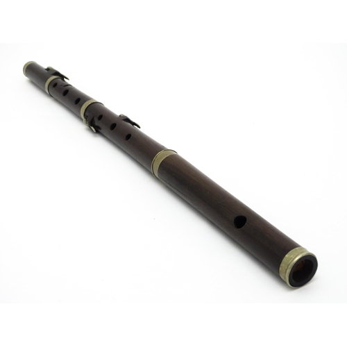 1294 - Musical Instrument : the major parts of an early 20thC three-piece piccolo flute, approx 19 1/2