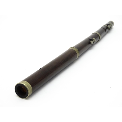 1294 - Musical Instrument : the major parts of an early 20thC three-piece piccolo flute, approx 19 1/2