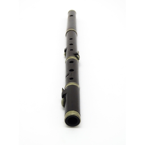 1294 - Musical Instrument : the major parts of an early 20thC three-piece piccolo flute, approx 19 1/2