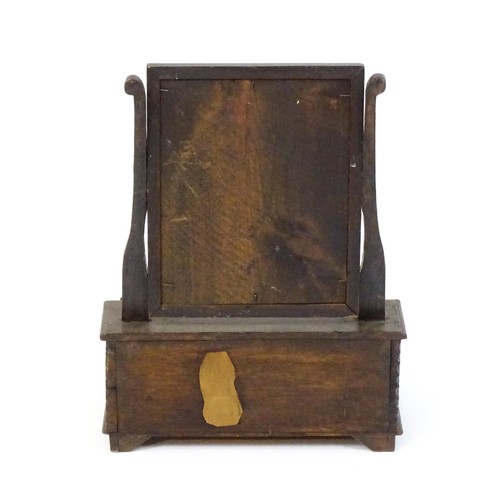 1737 - A mid 18thC oak toilet mirror with a rectangular glass above three short drawers set within a gradua... 