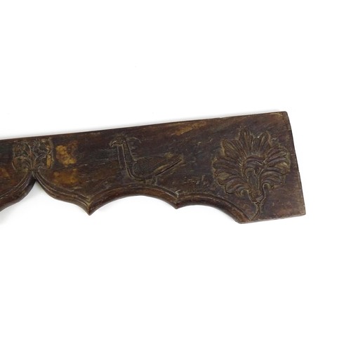 1678 - An 18th / 19thC carved beam / door pediment / frieze of shaped form with naive / folk art decoration... 