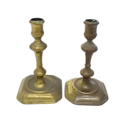 1186 - Two 18thC brass candlesticks with knop decoration to stem. Largest approx. 6 3/4