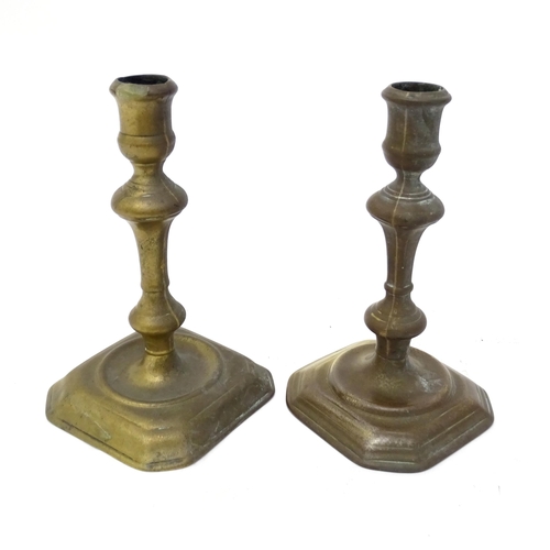 1186 - Two 18thC brass candlesticks with knop decoration to stem. Largest approx. 6 3/4