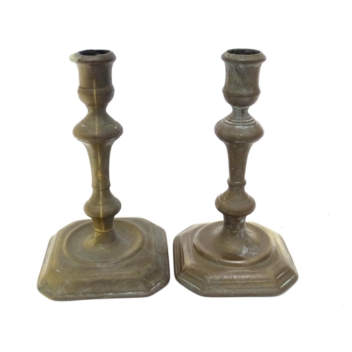 1186 - Two 18thC brass candlesticks with knop decoration to stem. Largest approx. 6 3/4