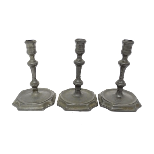 1186A - Three 18thC pewter candlesticks with knop detail to stems. Approx. 6