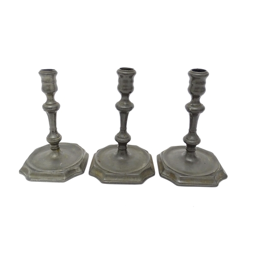 1186A - Three 18thC pewter candlesticks with knop detail to stems. Approx. 6