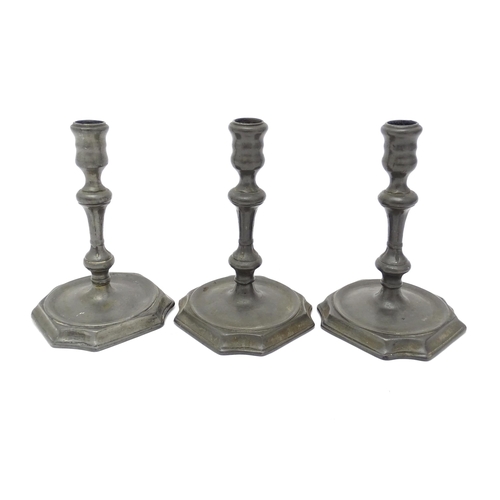 1186A - Three 18thC pewter candlesticks with knop detail to stems. Approx. 6