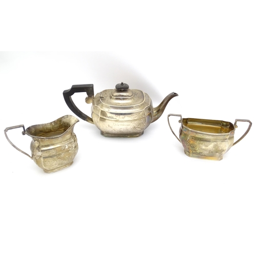 575 - A silver three piece tea set comprising teapot, milk jug and sugar bowl hallmarked Sheffield 1943, m... 