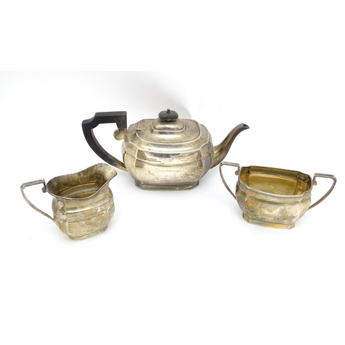 575 - A silver three piece tea set comprising teapot, milk jug and sugar bowl hallmarked Sheffield 1943, m... 