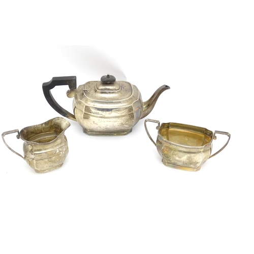 575 - A silver three piece tea set comprising teapot, milk jug and sugar bowl hallmarked Sheffield 1943, m... 