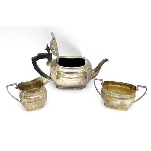 575 - A silver three piece tea set comprising teapot, milk jug and sugar bowl hallmarked Sheffield 1943, m... 