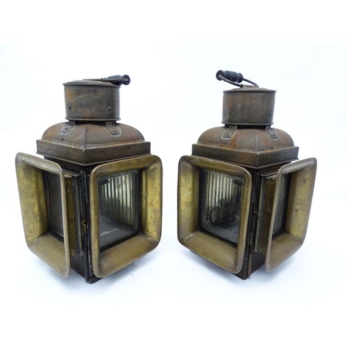 1289 - A pair of late 19thC railway / ship lanterns / lamps, each with two glass panels, a bracket to one s... 