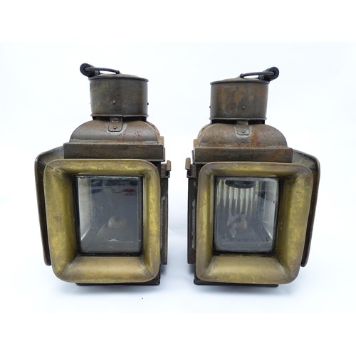 1289 - A pair of late 19thC railway / ship lanterns / lamps, each with two glass panels, a bracket to one s... 