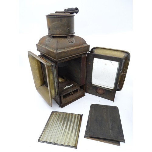 1289 - A pair of late 19thC railway / ship lanterns / lamps, each with two glass panels, a bracket to one s... 